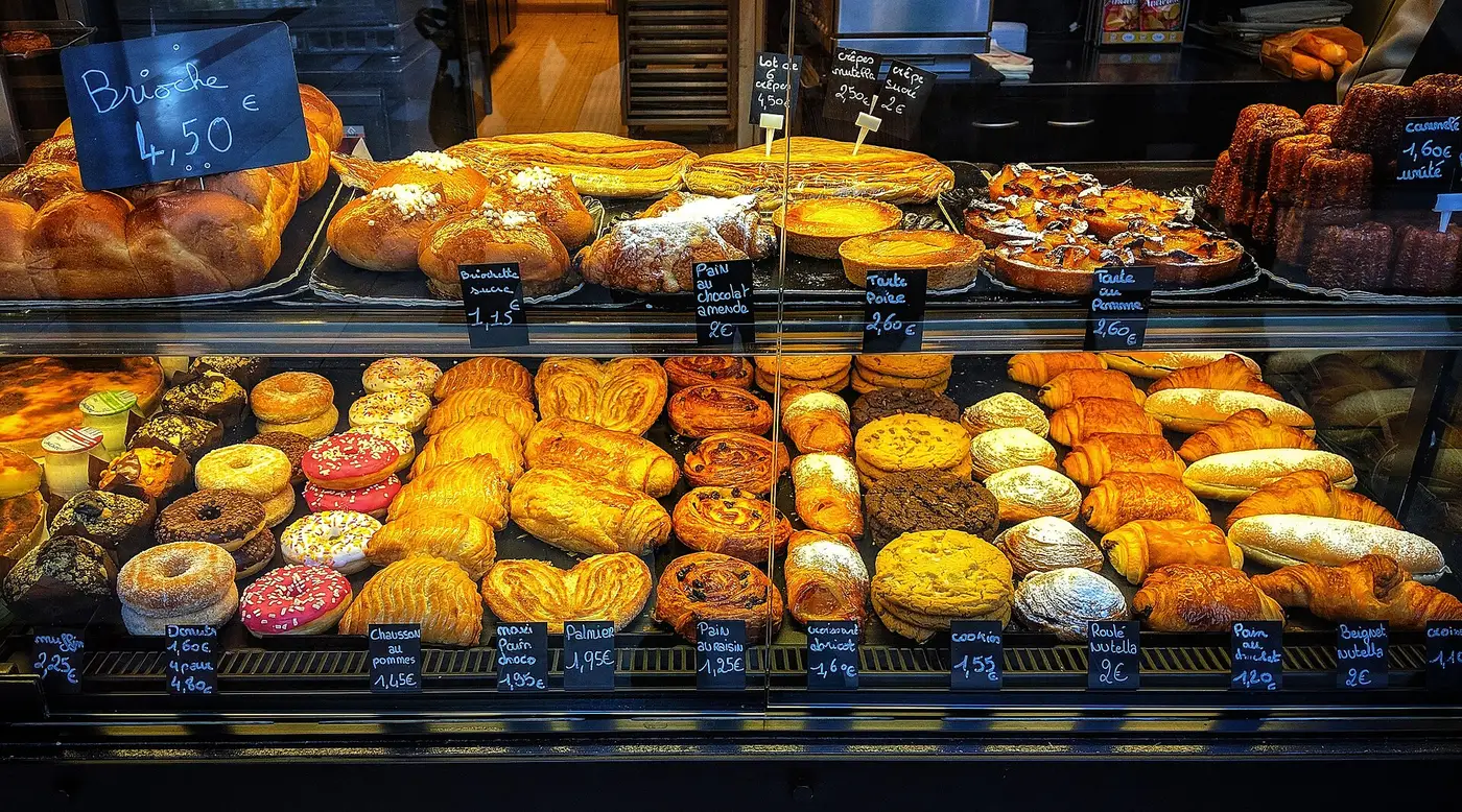 Croissants and other pastries on display in a French bakery. The photo was not taken in Apex.