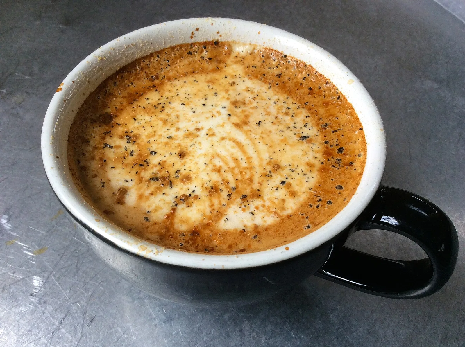A latte with foam art at Cocoa Cinnamon, a coffee shop in Durham. The photo was not taken in Apex.
