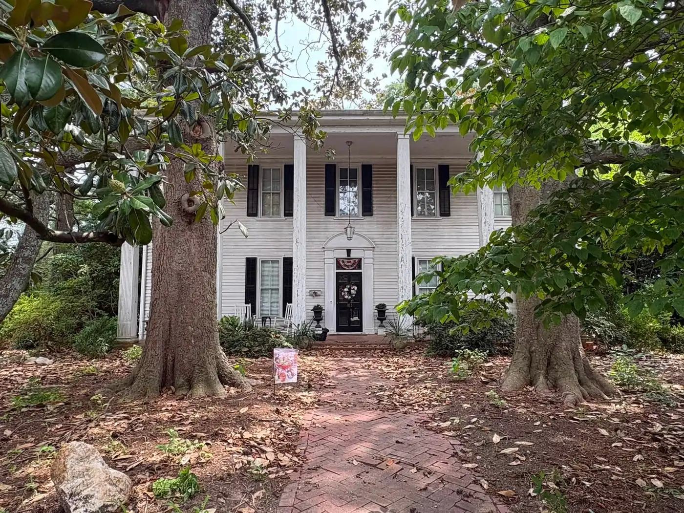 A historic two-story house with a columned porch at 103 S. Salem St., near downtown Apex.