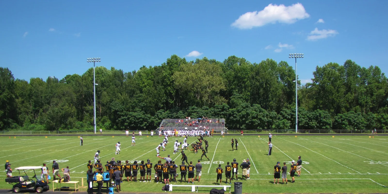 A Friday afternoon high school football game under the light towers in Fairmont, North Carolina.