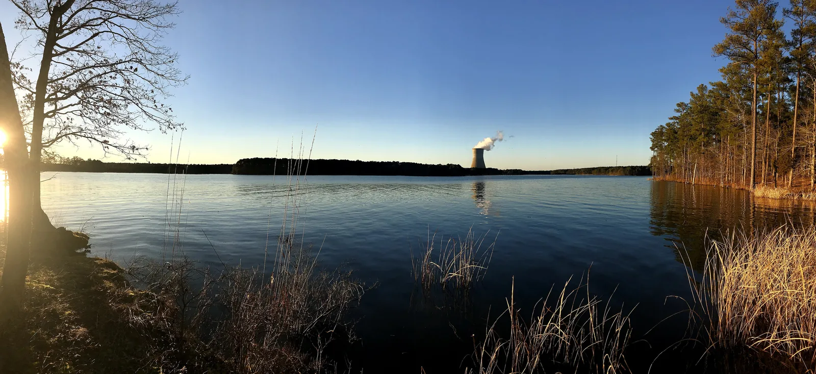 Sunset over Harris Lake from Harris Lake County Park in New Hill, southwest of Apex, with the Shearon Harris plant's cooling tower in the distance.