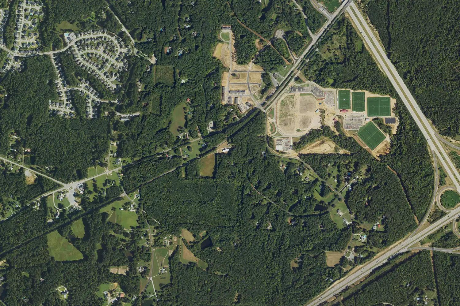 Aerial view of Pleasant Park's fields under construction in September 2022, with NC 540 at right and US 1 at lower right