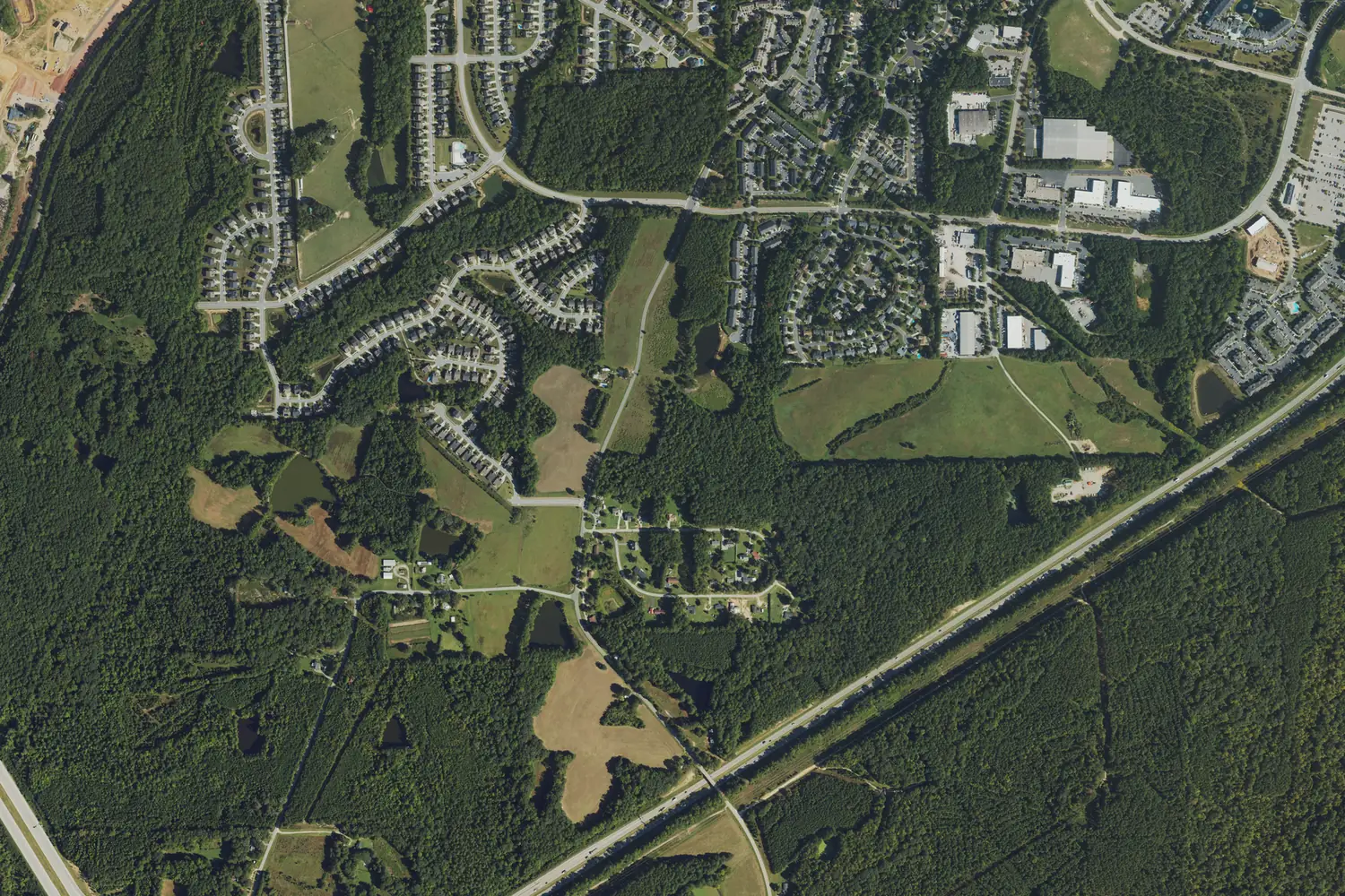 Aerial view of the Tingen area in September 2022, with subdivisions off Tingen Road and US 1 crossing the lower right