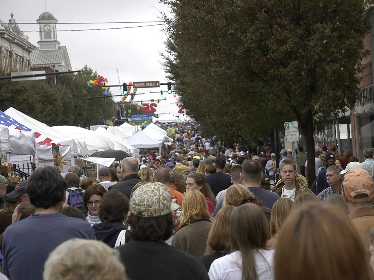 Crowds walk between vendor tents at the Barbecue Festival in downtown Lexington, N.C.