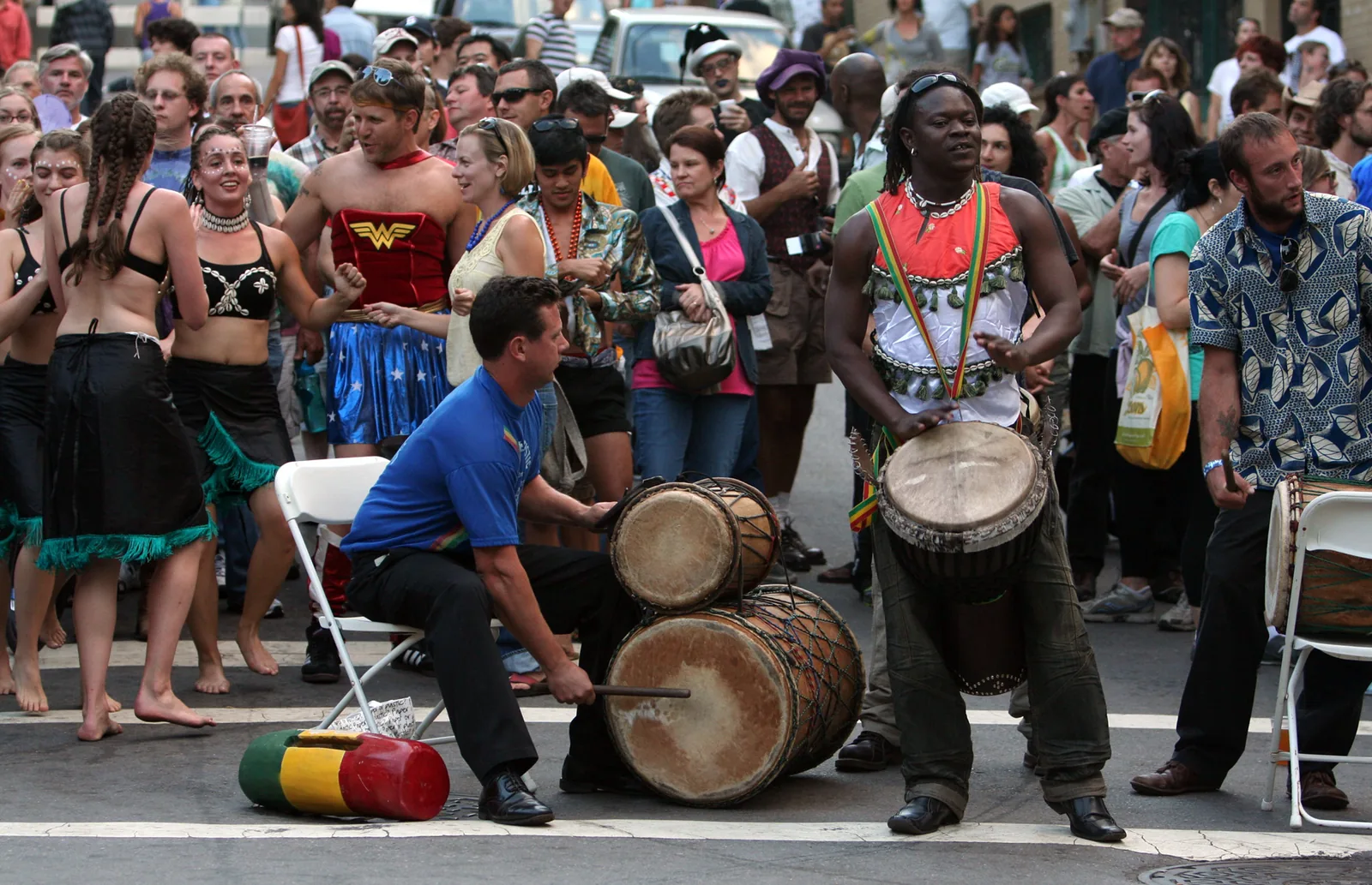 A drum and dance group performs for a street crowd at the Lexington Avenue Arts and Fun Festival in Asheville, N.C.