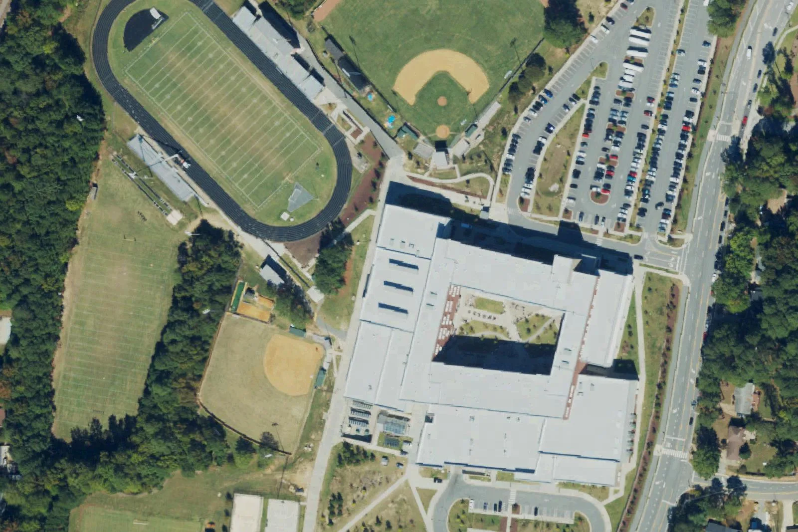 Apex High School's main building, stadium and ball fields off Laura Duncan Road in Apex, seen from the air