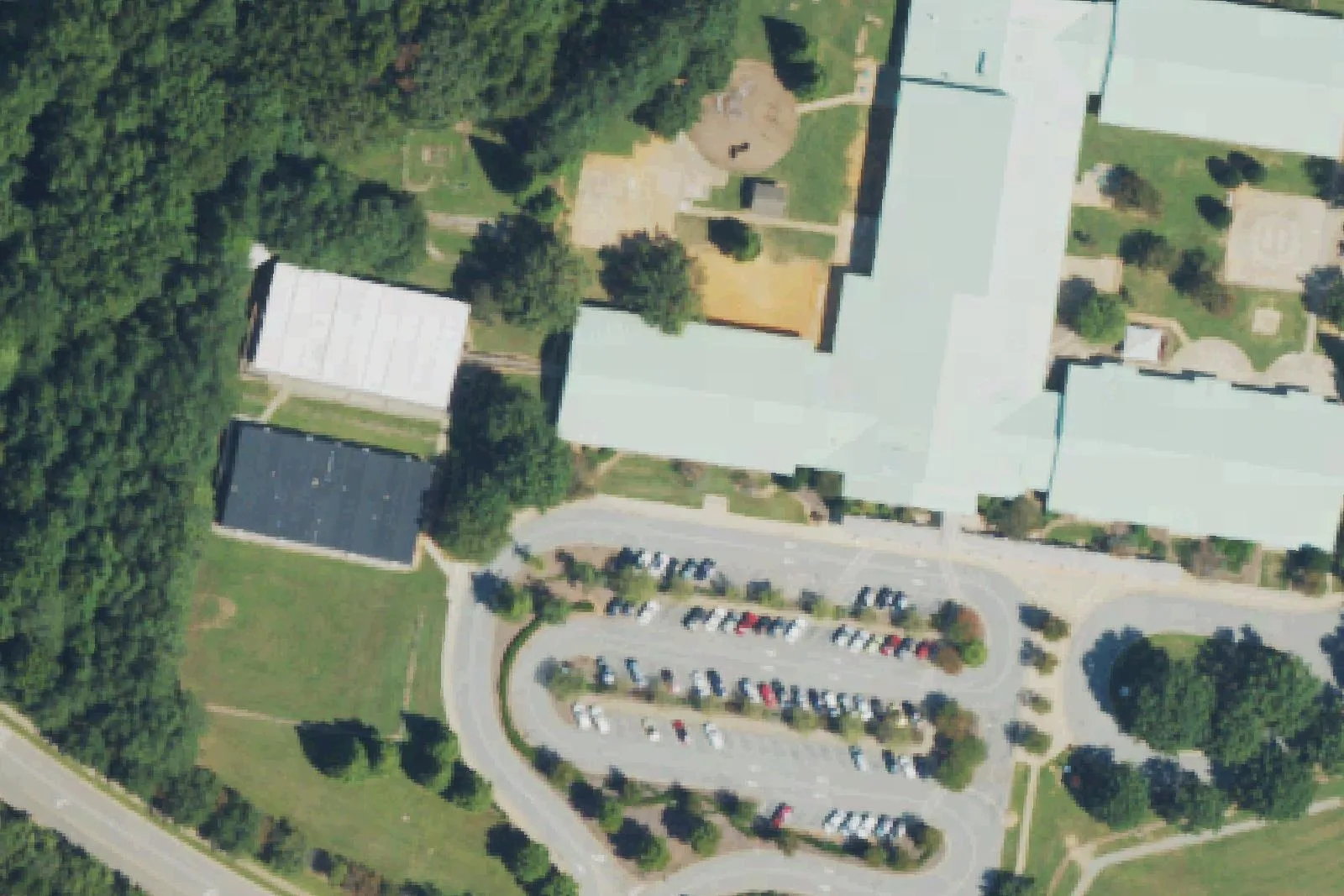 Middle Creek Elementary School's buildings and parking lot off Middle Creek Park Avenue, seen from the air