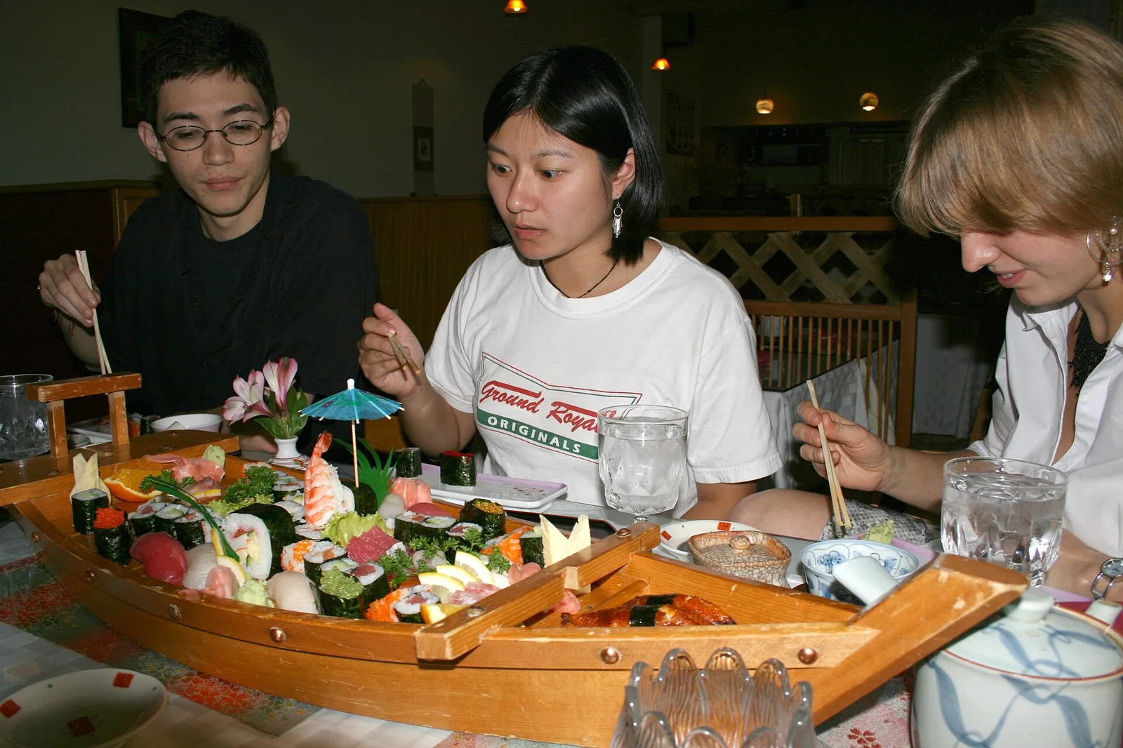 Sushi and sashimi served on a wooden boat at a Japanese restaurant. The photo was not taken in Apex.