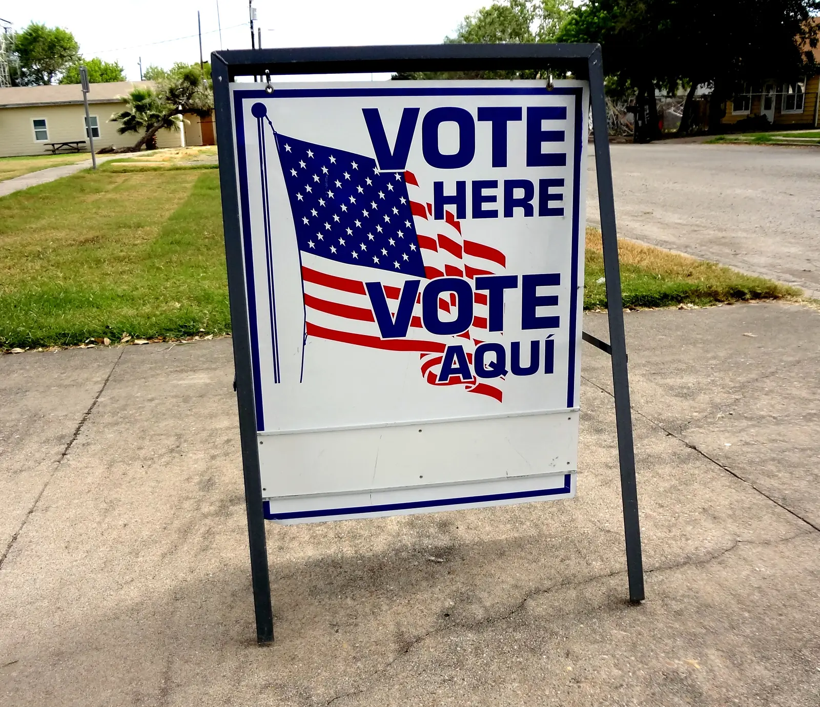 A bilingual Vote Here sign outside a polling place in Taft, Texas.